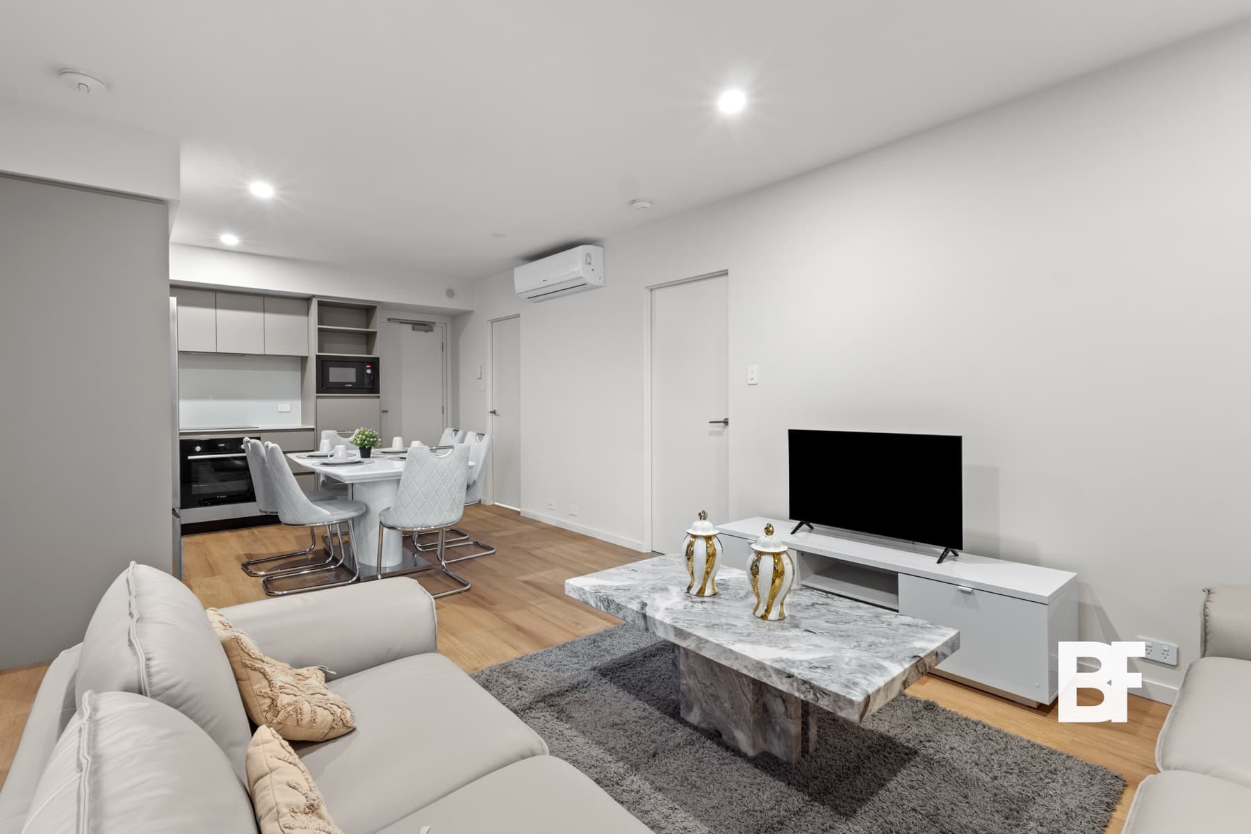 Reverse angle of a bright modern living room photographed by BASEFORM