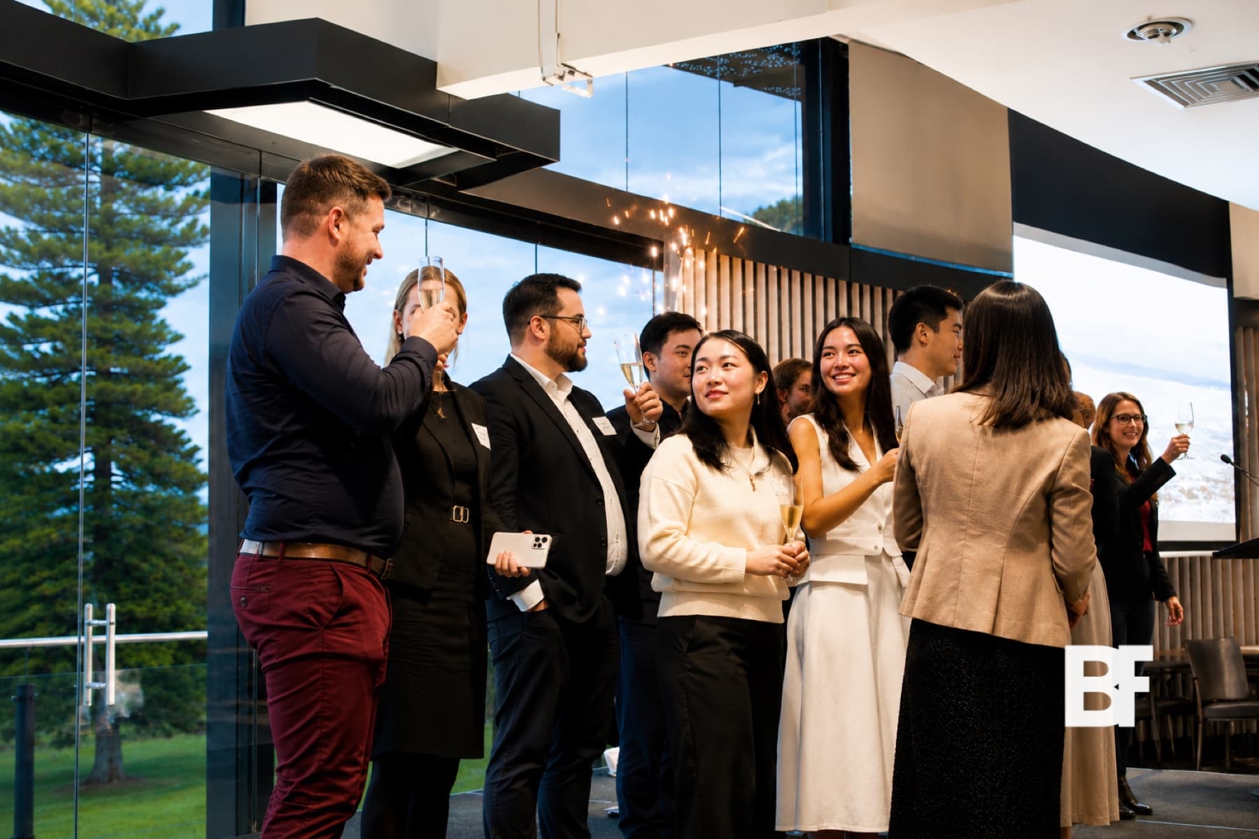 Guests networking at a corporate reception photographed by BASEFORM